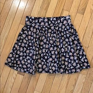 Black knit skater skirt with small floral motif